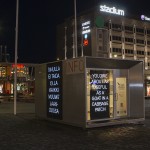 Kiosk with Finnish and English banners